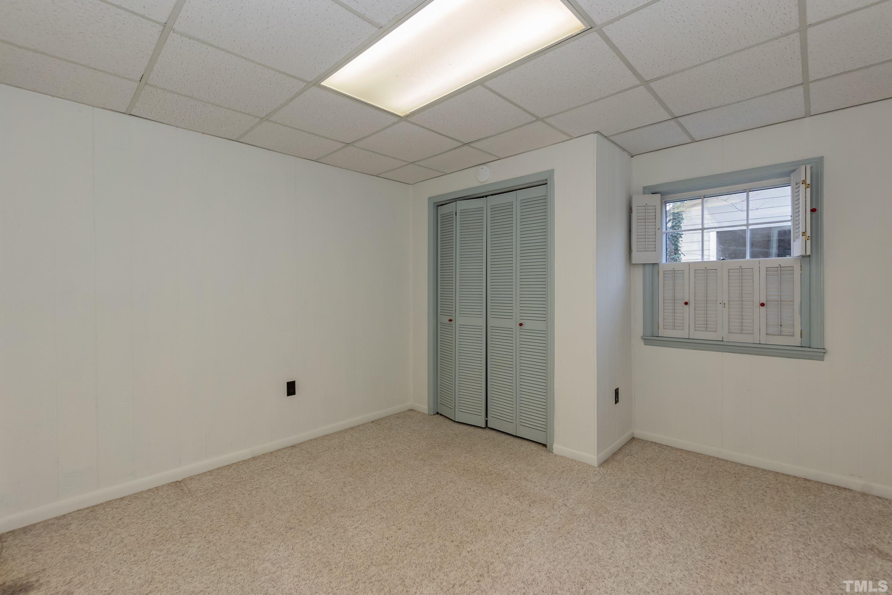 1104 Deboy Street Raleigh, NC 27606 - Photo 28 of 38 an empty room with windows and closet