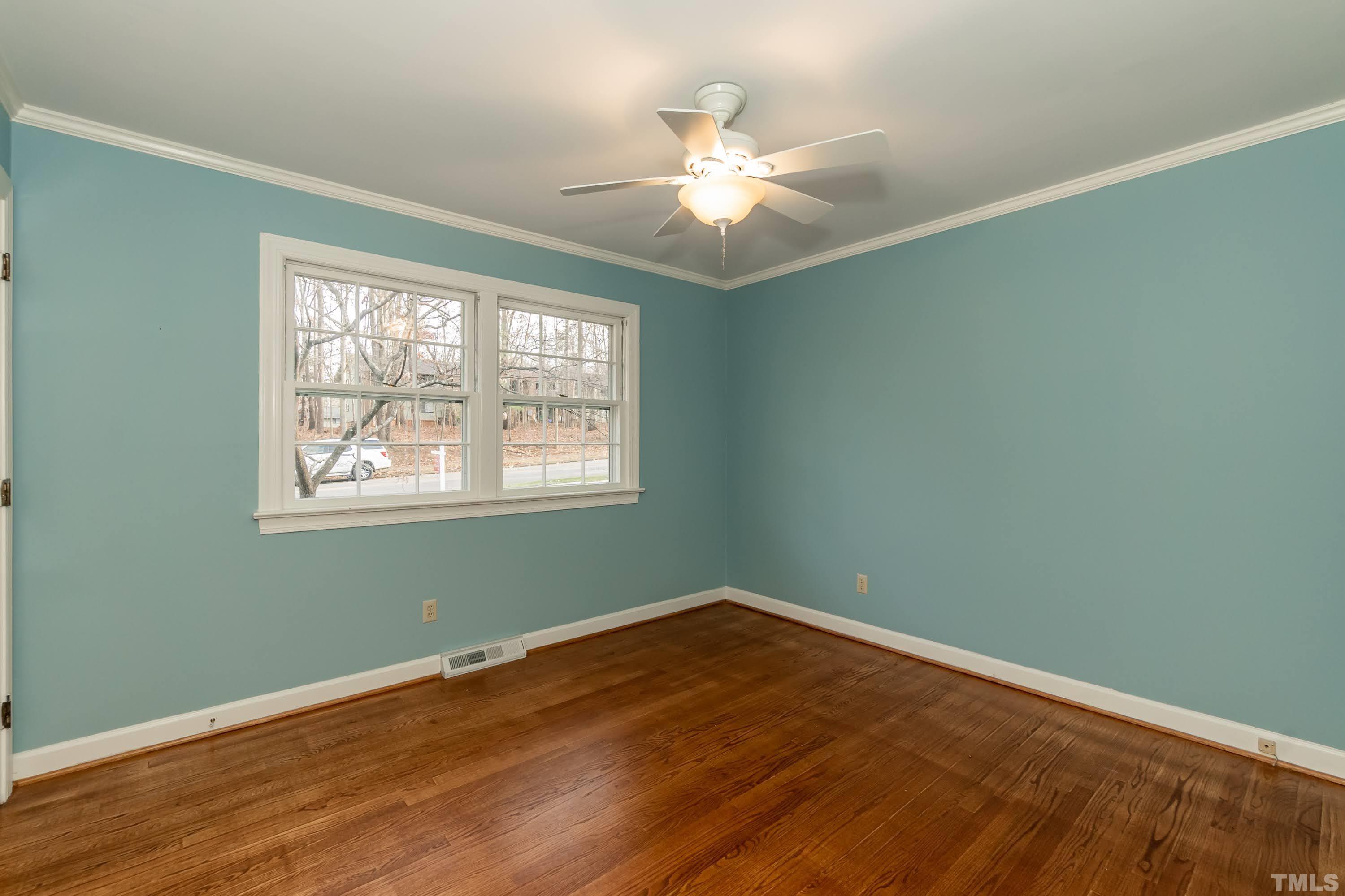 1104 Deboy Street Raleigh, NC 27606 - Photo 33 of 38 an empty room with wooden floor fan and window