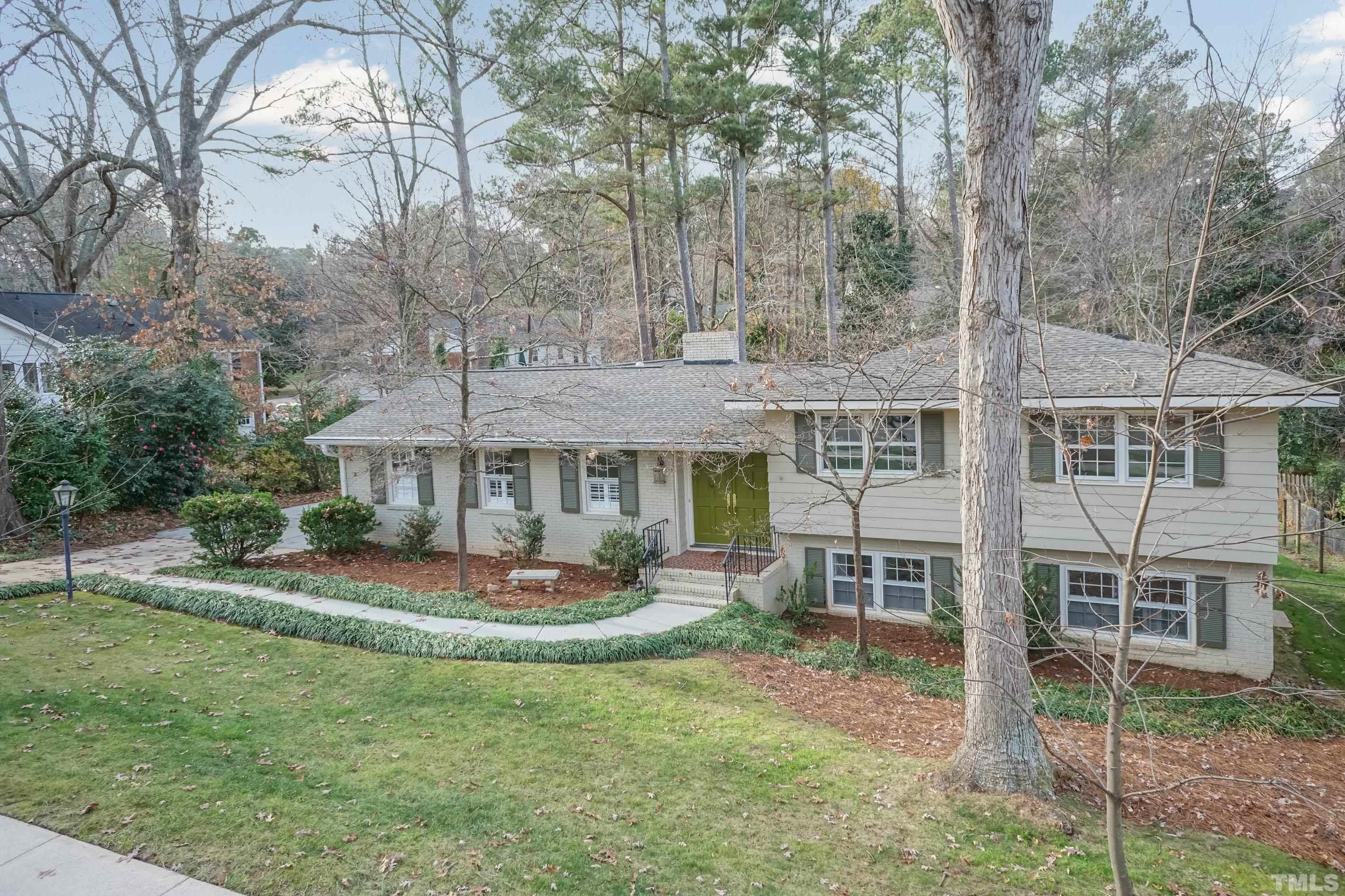 1104 Deboy Street Raleigh, NC 27606 - Photo 38 of 38 a front view of a house with a garden