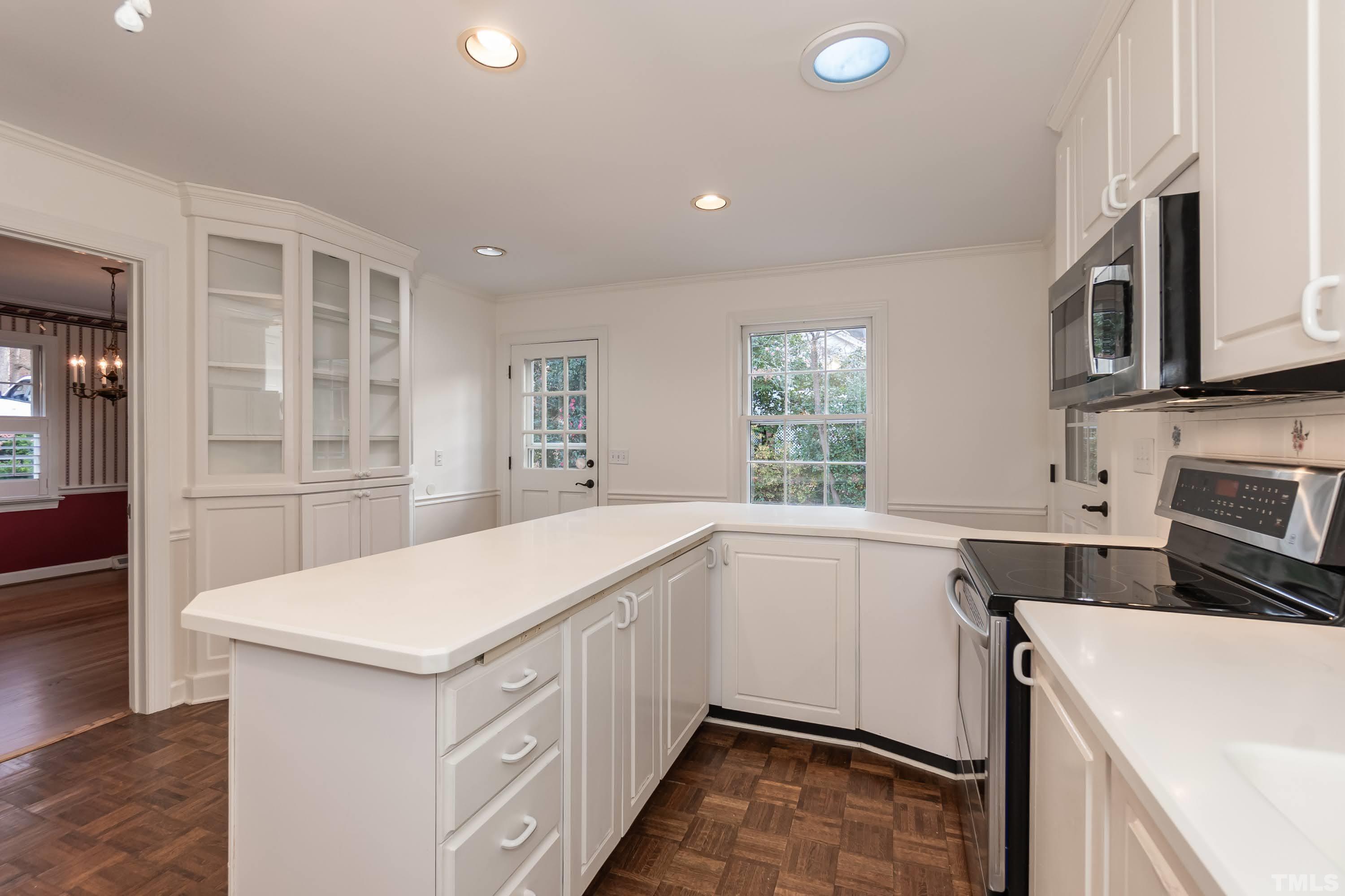 1104 Deboy Street Raleigh, NC 27606 - Photo 6 of 38 a kitchen that has a sink and a stove in it