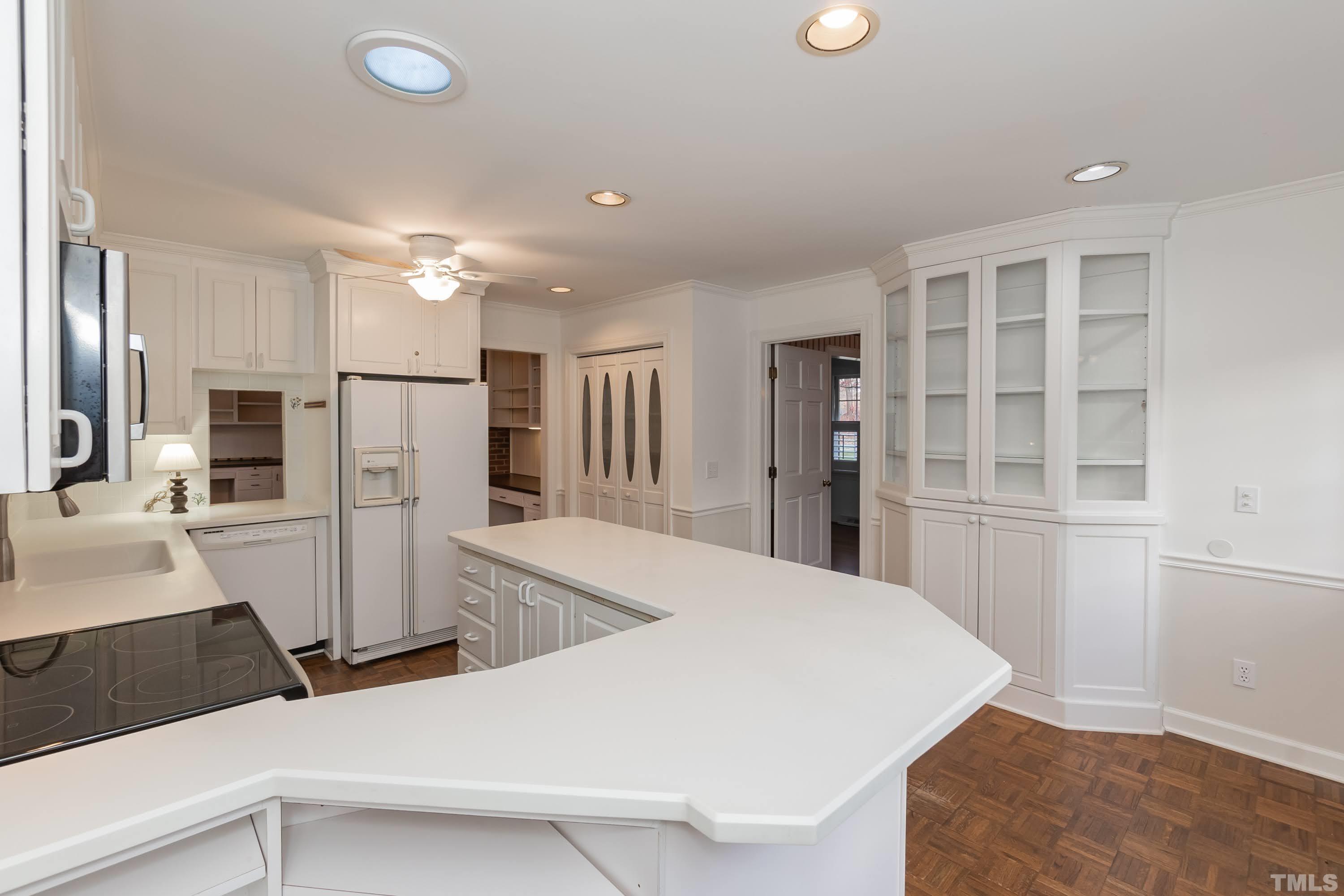 1104 Deboy Street Raleigh, NC 27606 - Photo 8 of 38 a kitchen with stainless steel appliances a refrigerator and a sink