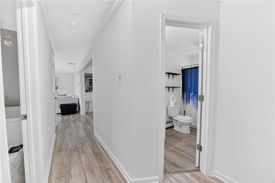 7290 Heather Road Macungie, PA 18062 - Photo 22 of 39 Clean lines and light-toned flooring characterize this well-maintained interior hallway.