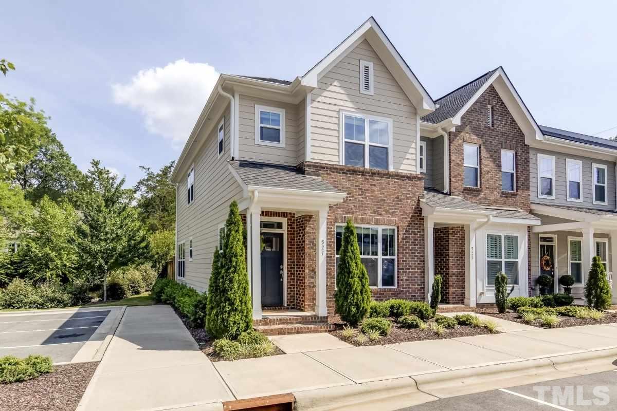 527 Ledbetter Court Raleigh, NC 27608 - Photo 1 of 13 a front view of a house with garden