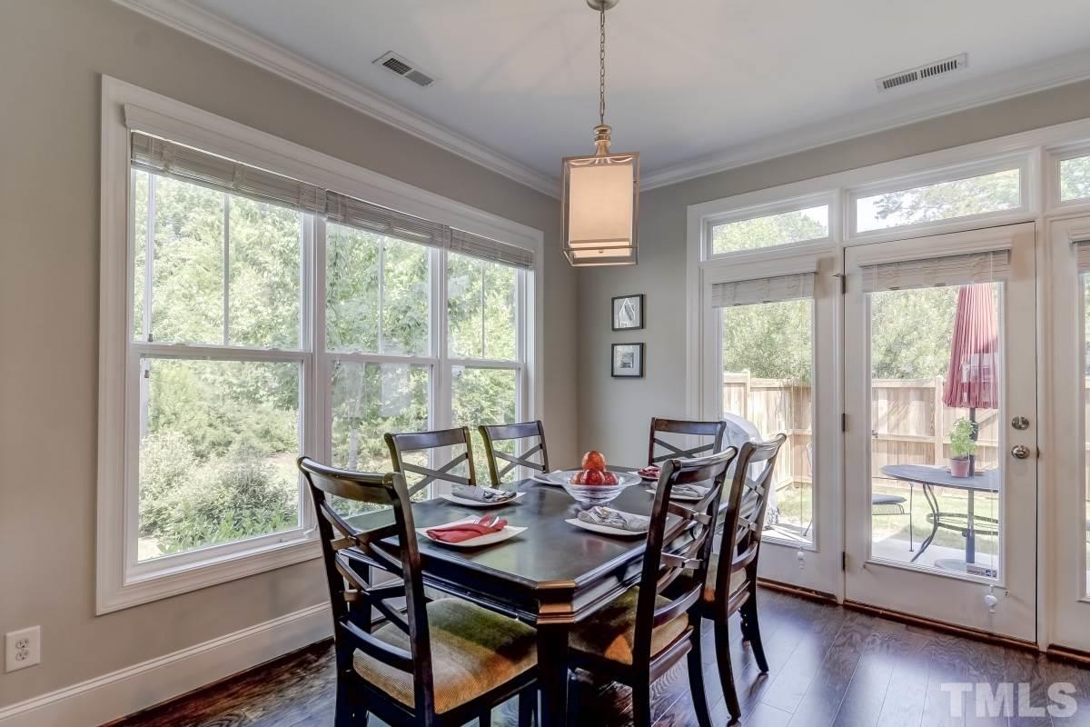 527 Ledbetter Court Raleigh, NC 27608 - Photo 5 of 13 a view of a dining room with furniture window and wooden floor