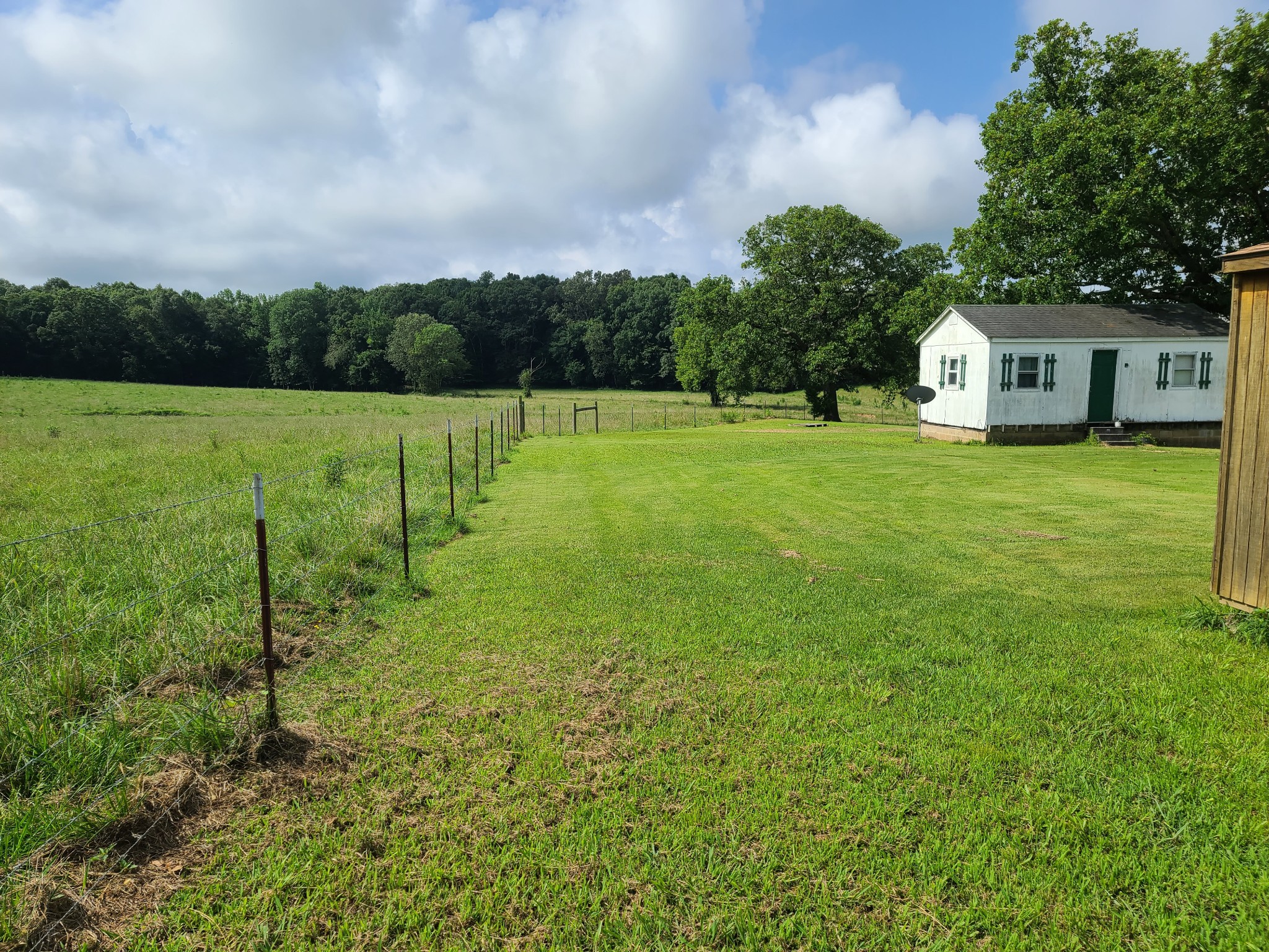 503 Bain Road Big Sandy, TN 38221 - Photo 3 of 4 a view of a house with a big yard