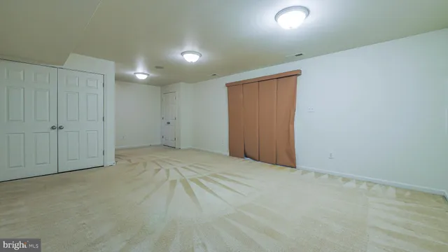 a view of a room with wooden walls