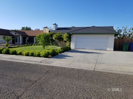 309 Petris Avenue Ridgecrest, CA 93555 - Photo 1 of 19 a view of a house with a street