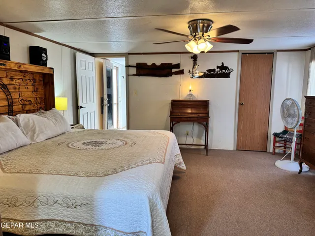 a bed room with a bed and a chair