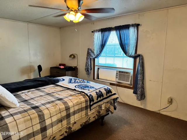 a bedroom with a bed and a fireplace