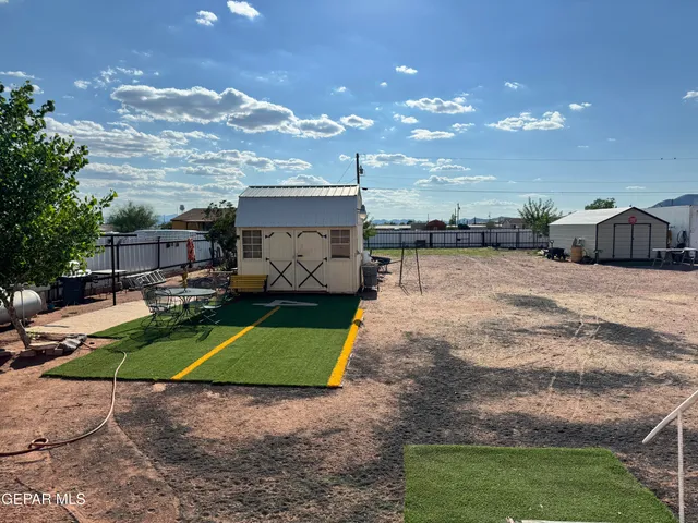 a view of a house with a snow in the yard
