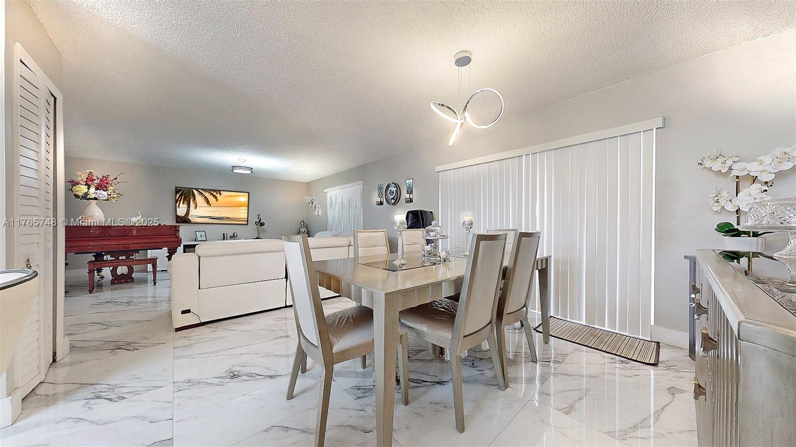 13539 Southwest 62nd Street, Unit 1 Miami, FL 33183 - Photo 16 of 38 a view of a dining area with furniture