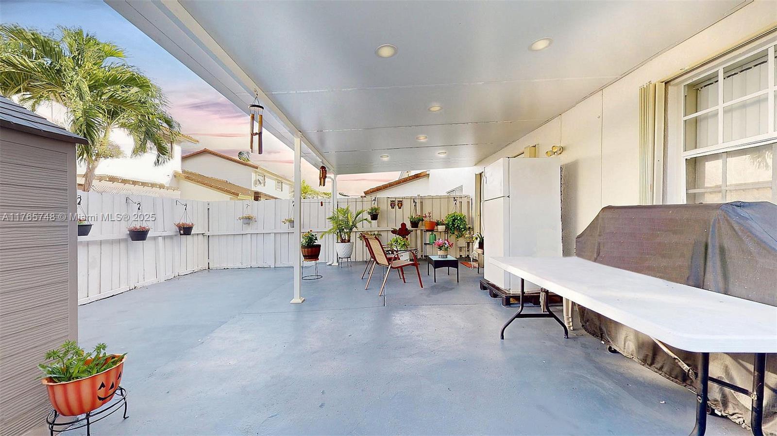 13539 Southwest 62nd Street, Unit 1 Miami, FL 33183 - Photo 36 of 38 a living room with furniture and a potted plant