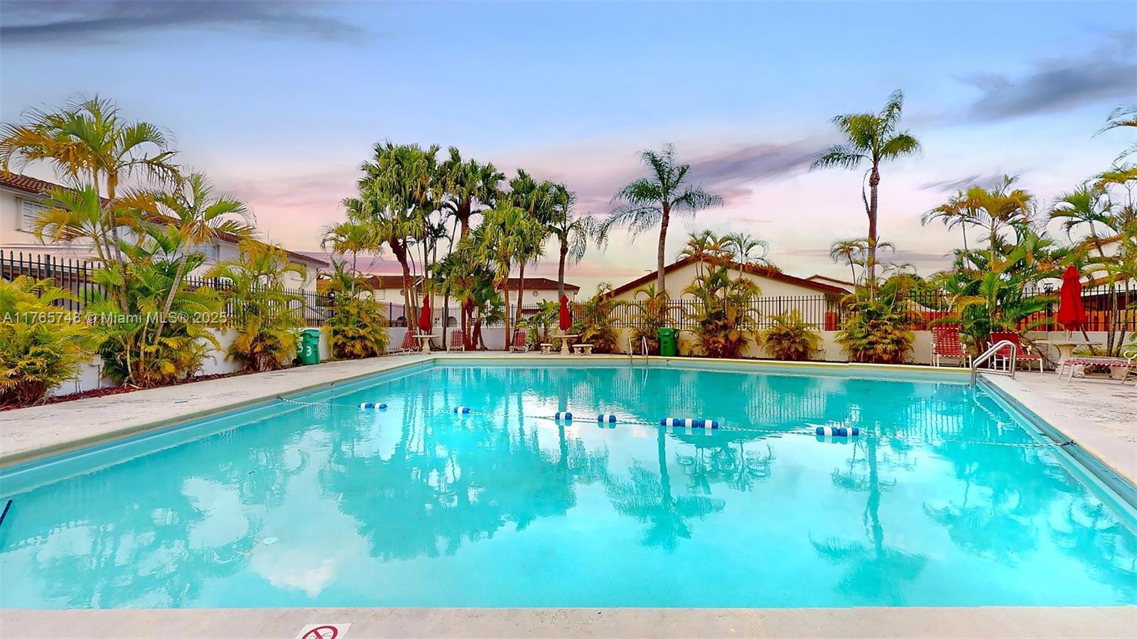 13539 Southwest 62nd Street, Unit 1 Miami, FL 33183 - Photo 37 of 38 a view of swimming pool with a yard