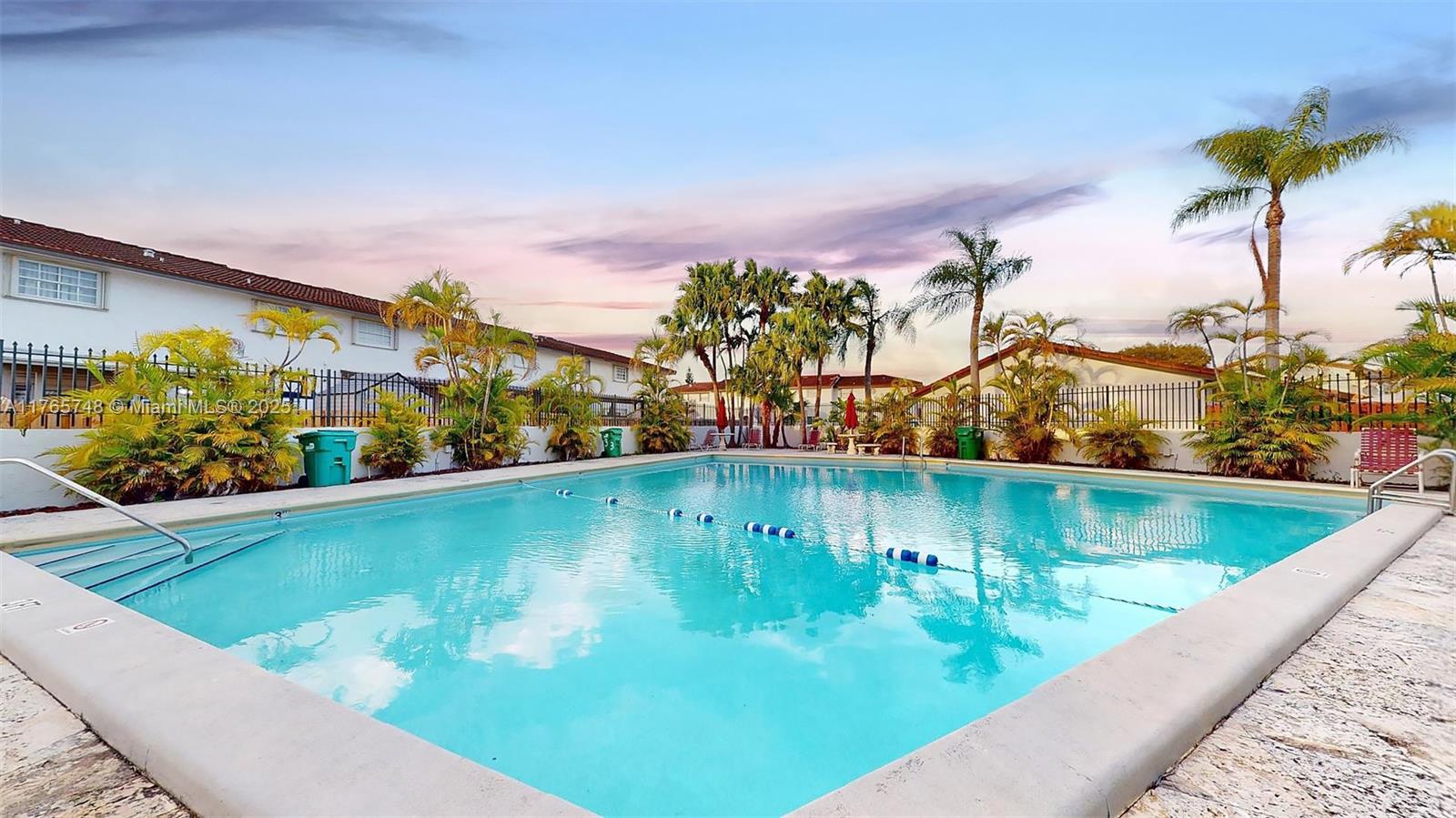 13539 Southwest 62nd Street, Unit 1 Miami, FL 33183 - Photo 38 of 38 a view of a swimming pool with a lake view