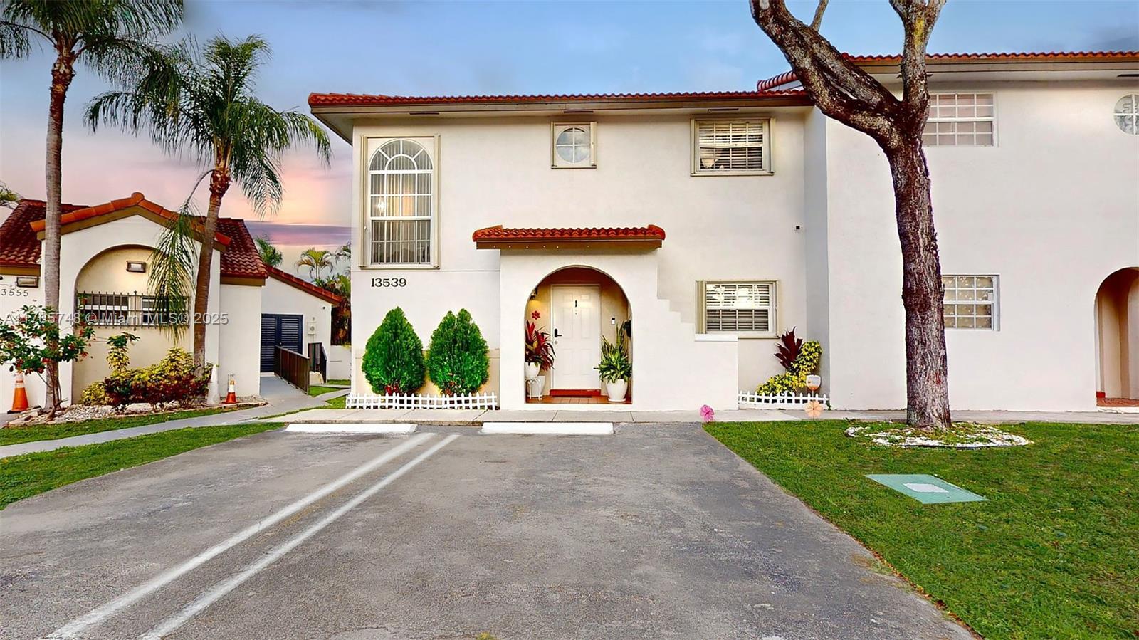 13539 Southwest 62nd Street, Unit 1 Miami, FL 33183 - Photo 5 of 38 a front view of a house with a garden