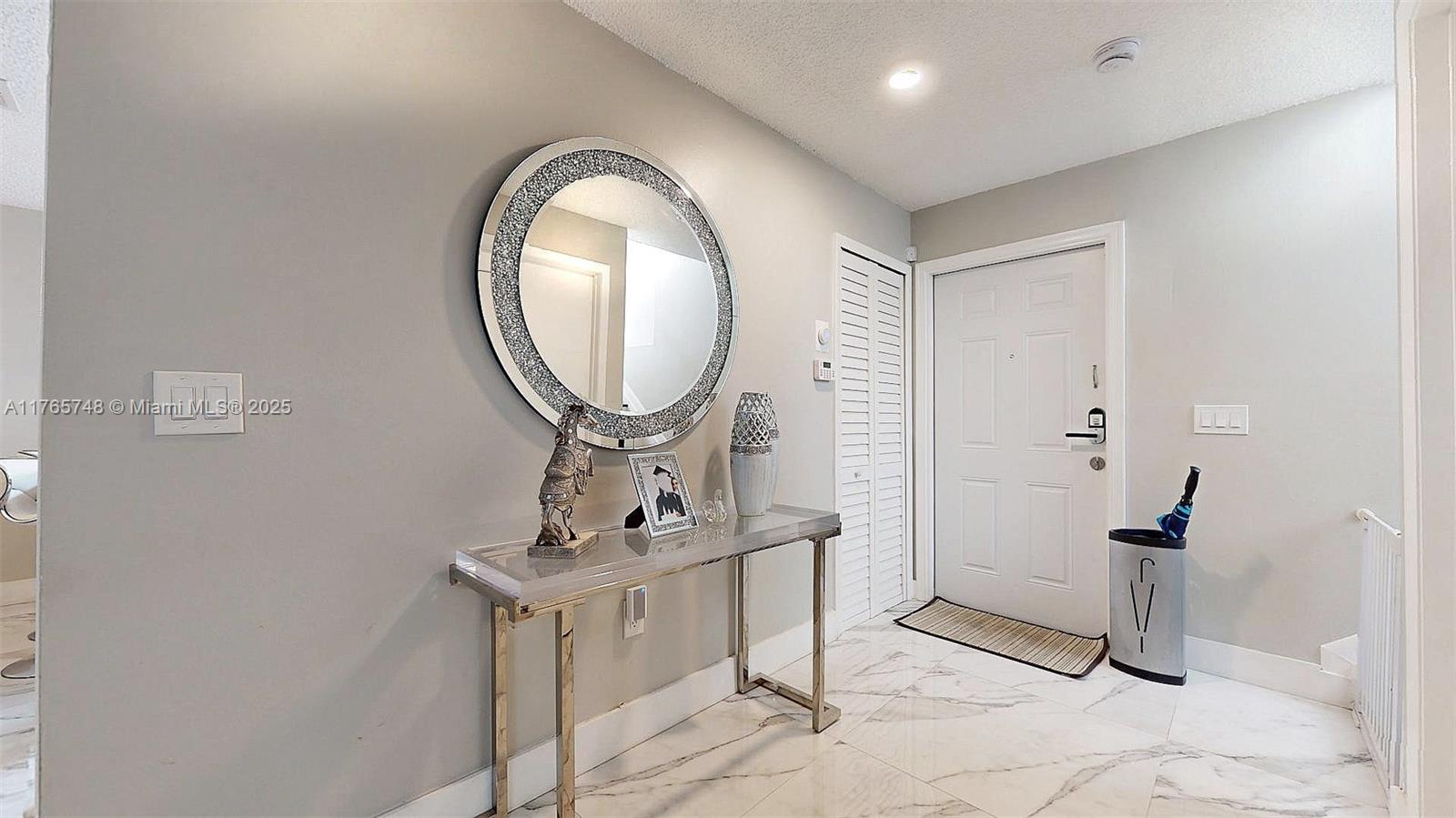 13539 Southwest 62nd Street, Unit 1 Miami, FL 33183 - Photo 6 of 38 a room with filled with furniture and a mirror