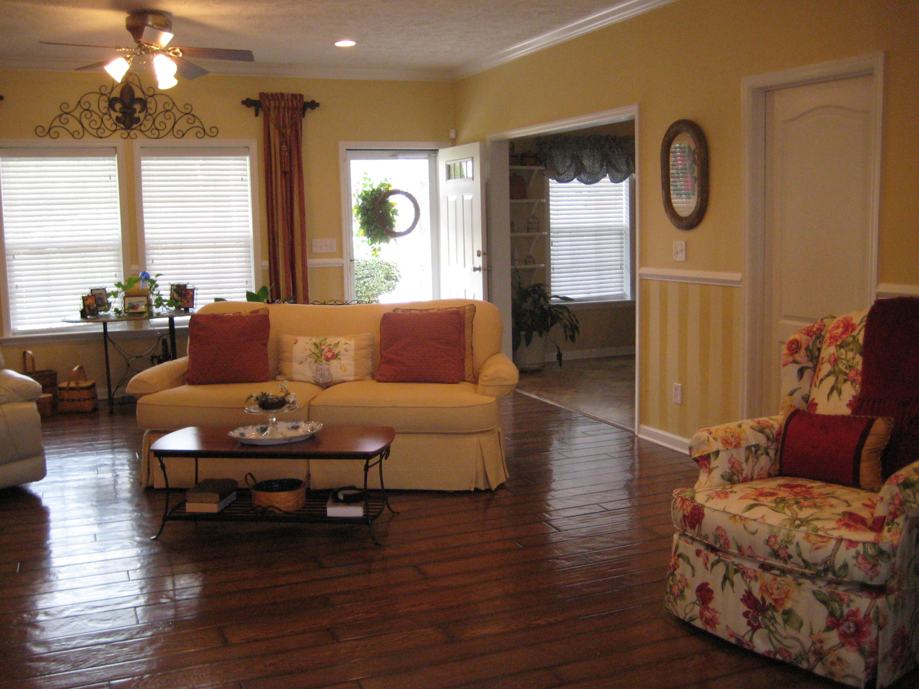 6024 Sand Hill Road Crestview, FL 32539 - Photo 18 of 43 a living room with furniture wooden floor and a large window