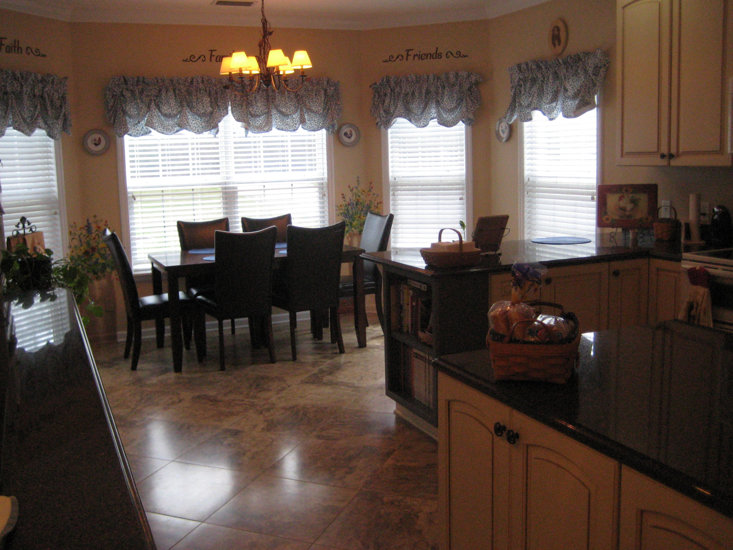 6024 Sand Hill Road Crestview, FL 32539 - Photo 33 of 43 a kitchen with a table and chairs