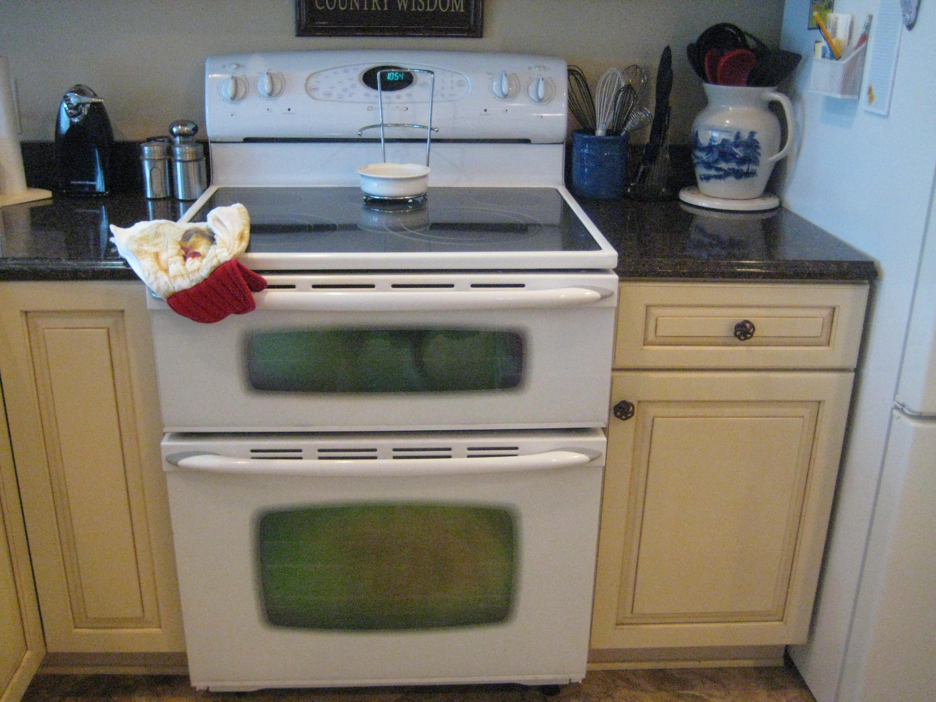 6024 Sand Hill Road Crestview, FL 32539 - Photo 38 of 43 a stove top oven sitting inside of a kitchen