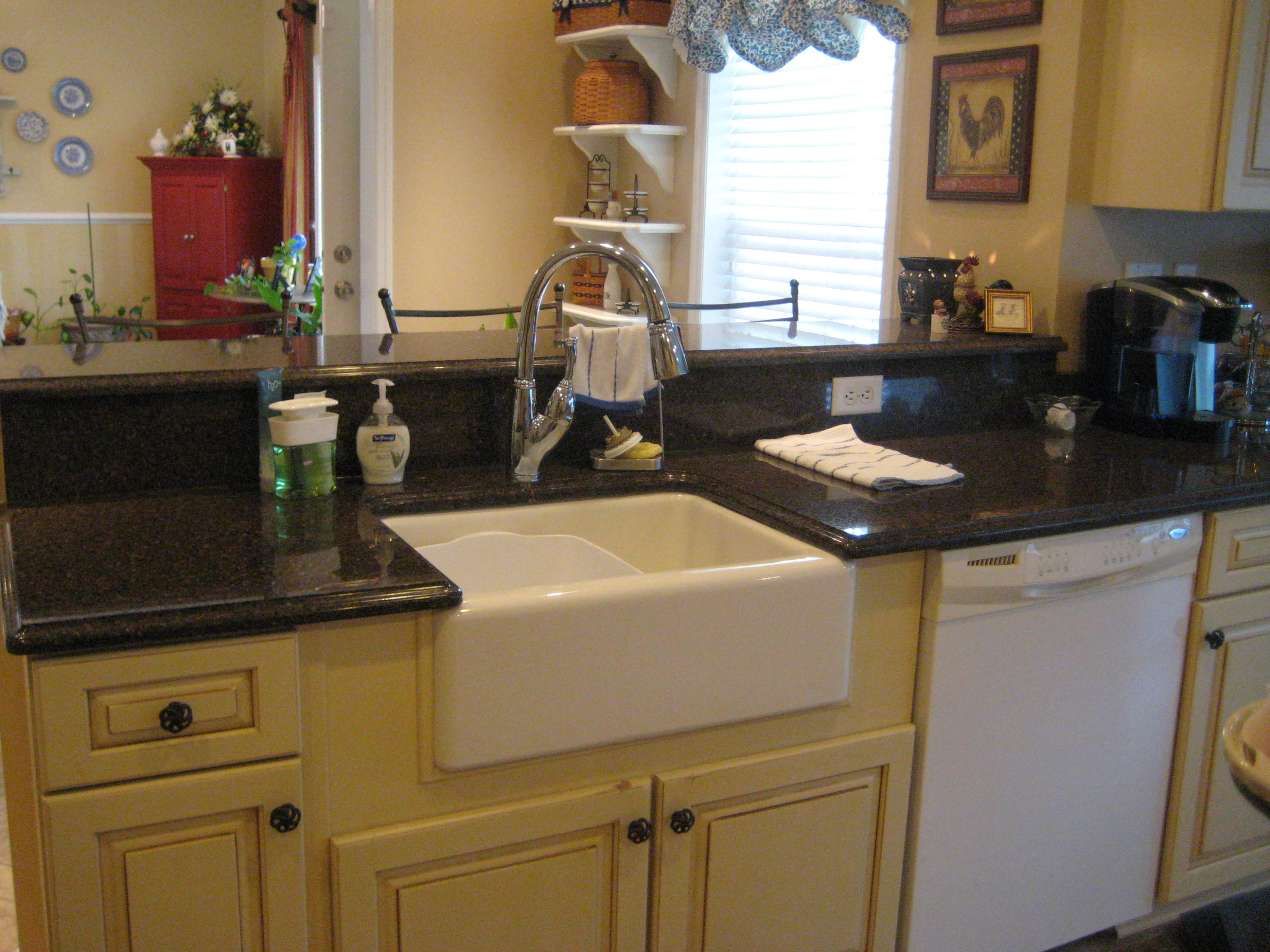 6024 Sand Hill Road Crestview, FL 32539 - Photo 41 of 43 a kitchen with cabinets and window