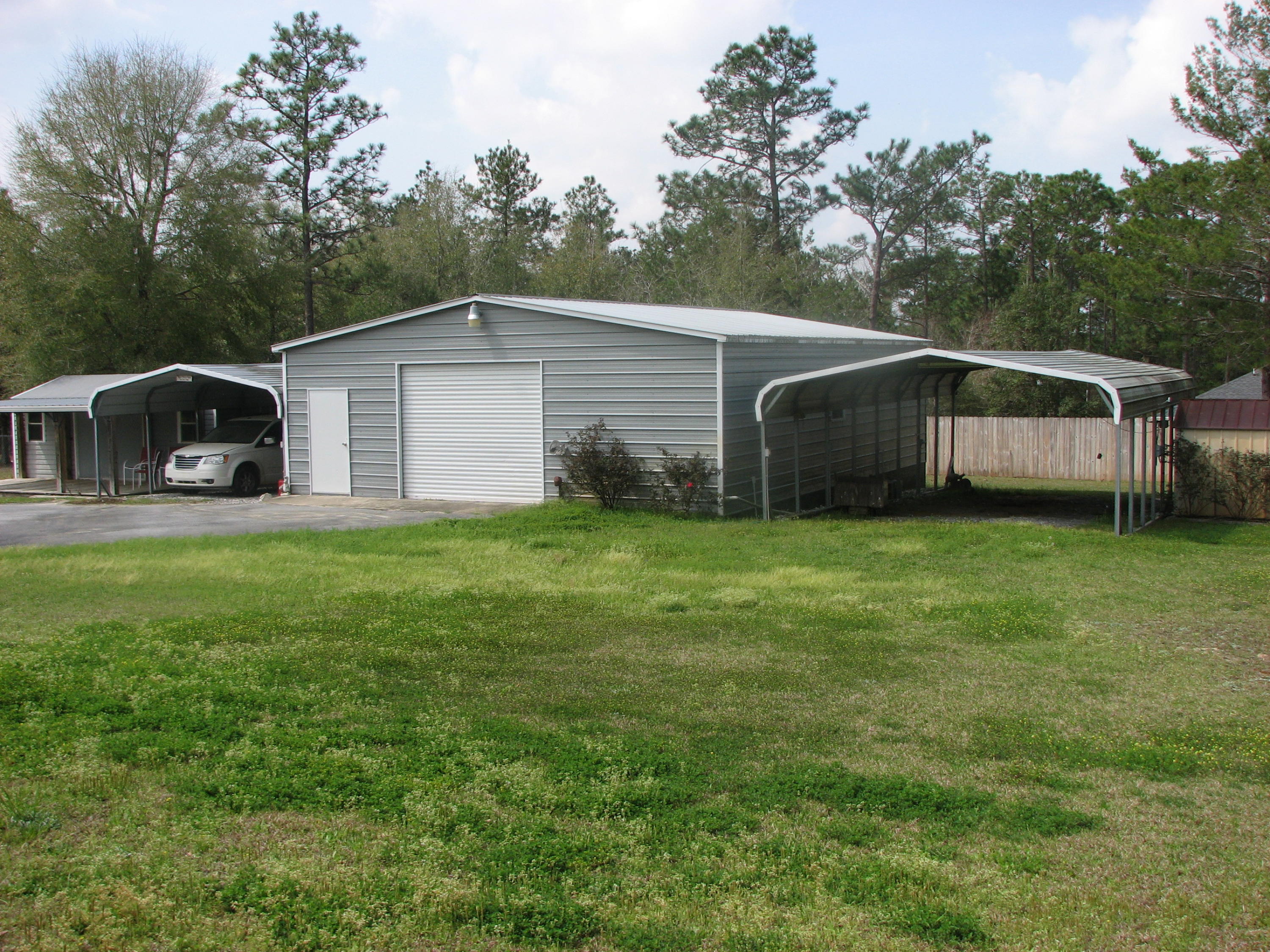 6024 Sand Hill Road Crestview, FL 32539 - Photo 5 of 43 a view of a house with a yard
