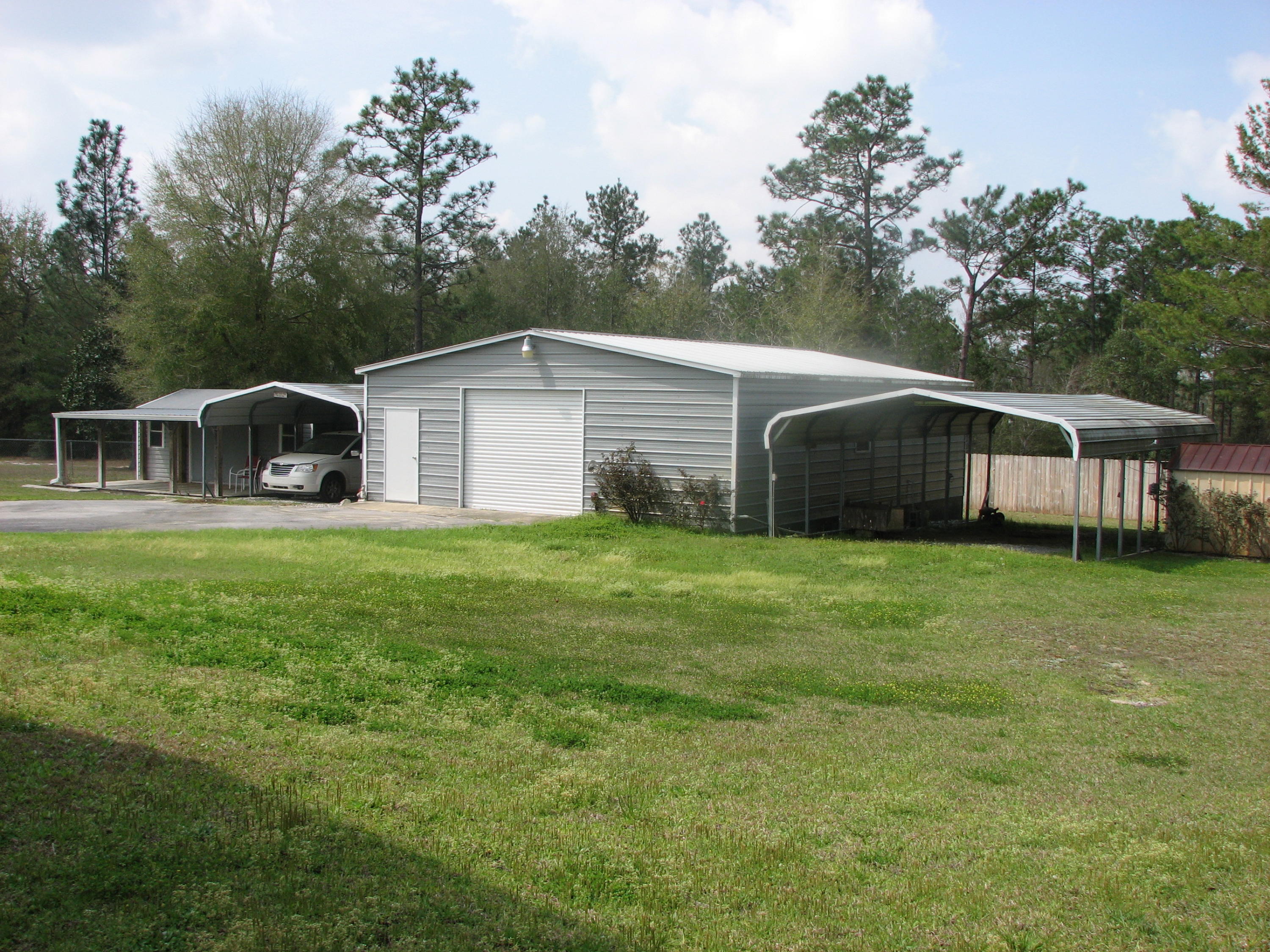 6024 Sand Hill Road Crestview, FL 32539 - Photo 6 of 43 a front view of house with yard and green space