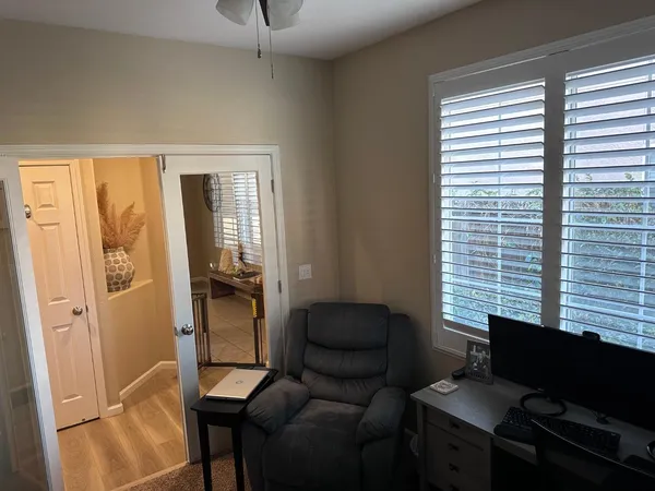 a living room with furniture and a window