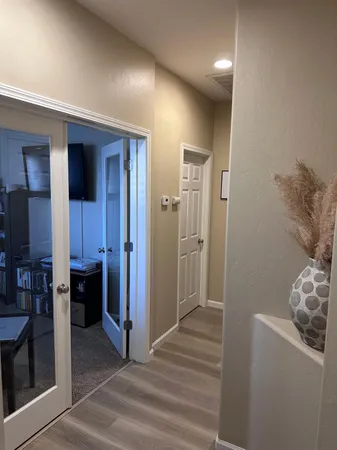 a view of a livingroom with furniture and front door