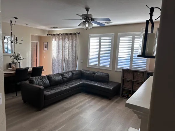 a living room with furniture and a window