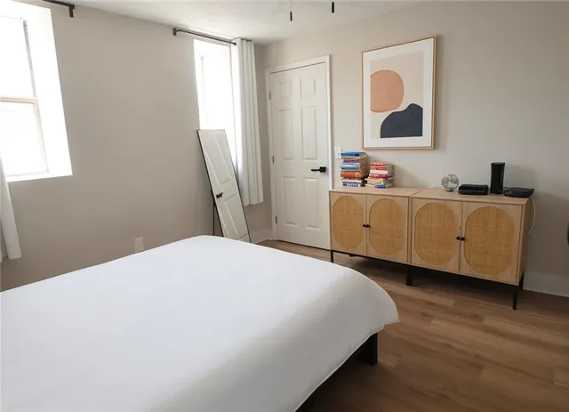 a bed room with a bed and a window