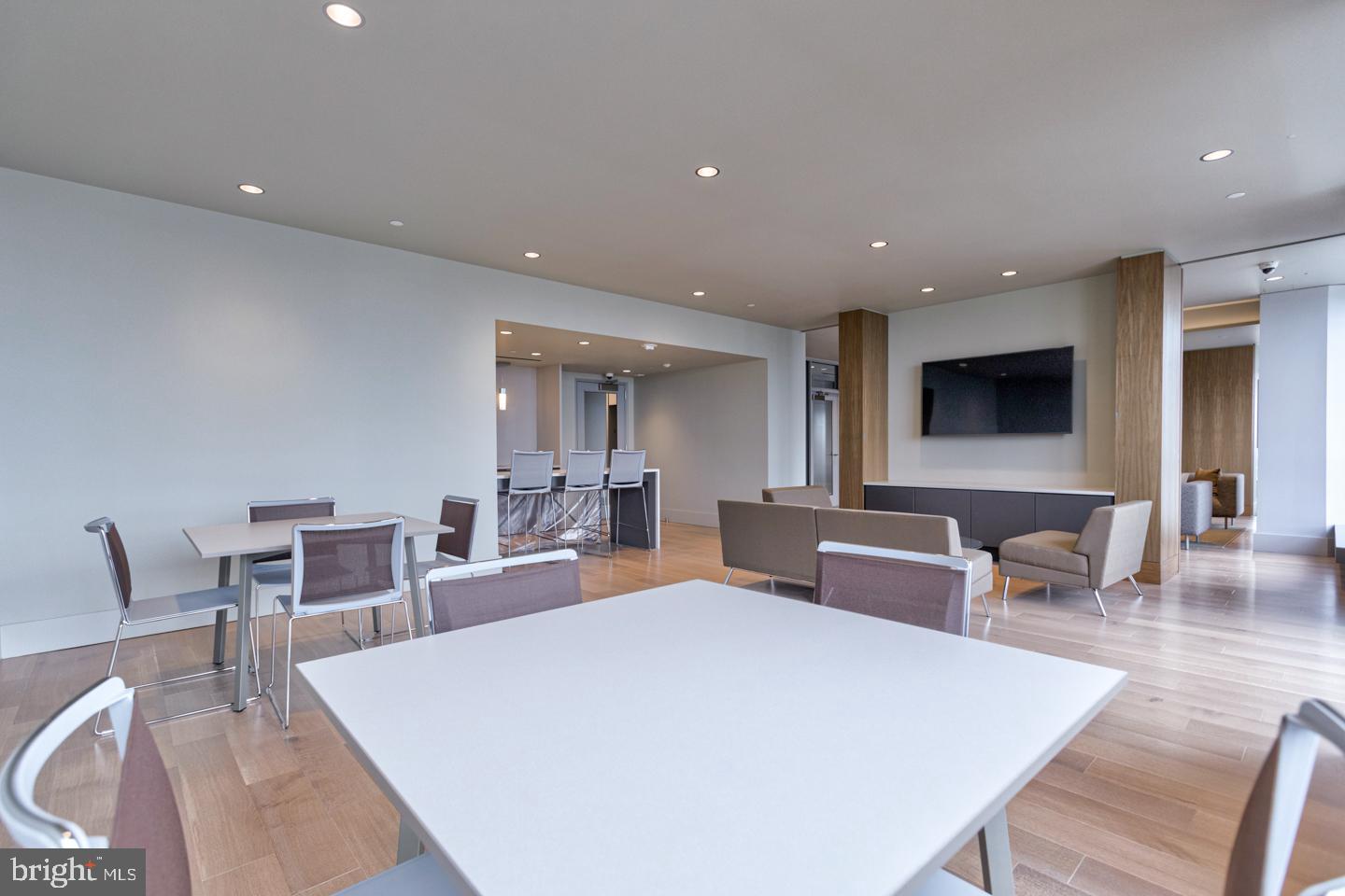2020 Walnut Street, Unit 11A Philadelphia, PA 19103 - Photo 16 of 20 a large white dining hall with stainless steel appliances a dining table and chairs with kitchen island