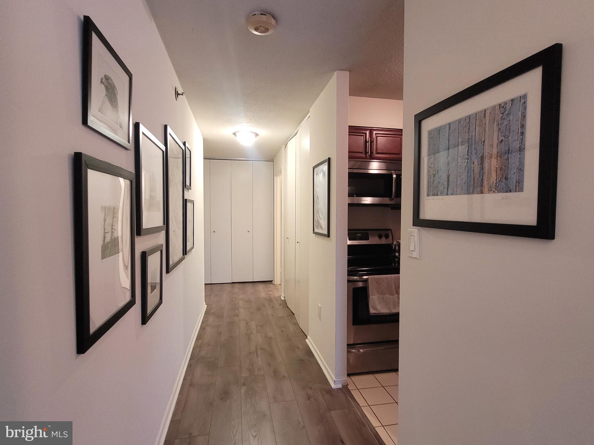 2020 Walnut Street, Unit 11A Philadelphia, PA 19103 - Photo 10 of 20 a view of a hallway with wooden floor and windows