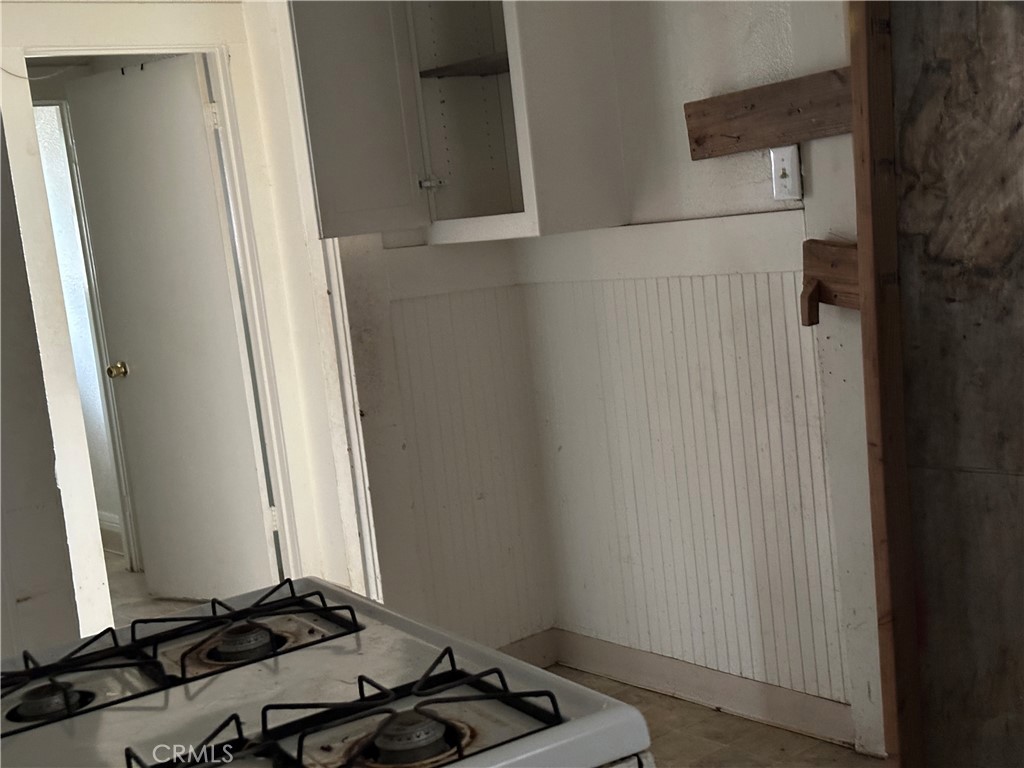 50 West 20th Street Merced, CA 95340 - Photo 12 of 20 a room with a refrigerator and a window