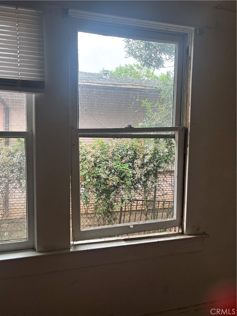 50 West 20th Street Merced, CA 95340 - Photo 20 of 20 an empty room with wooden floor and a window