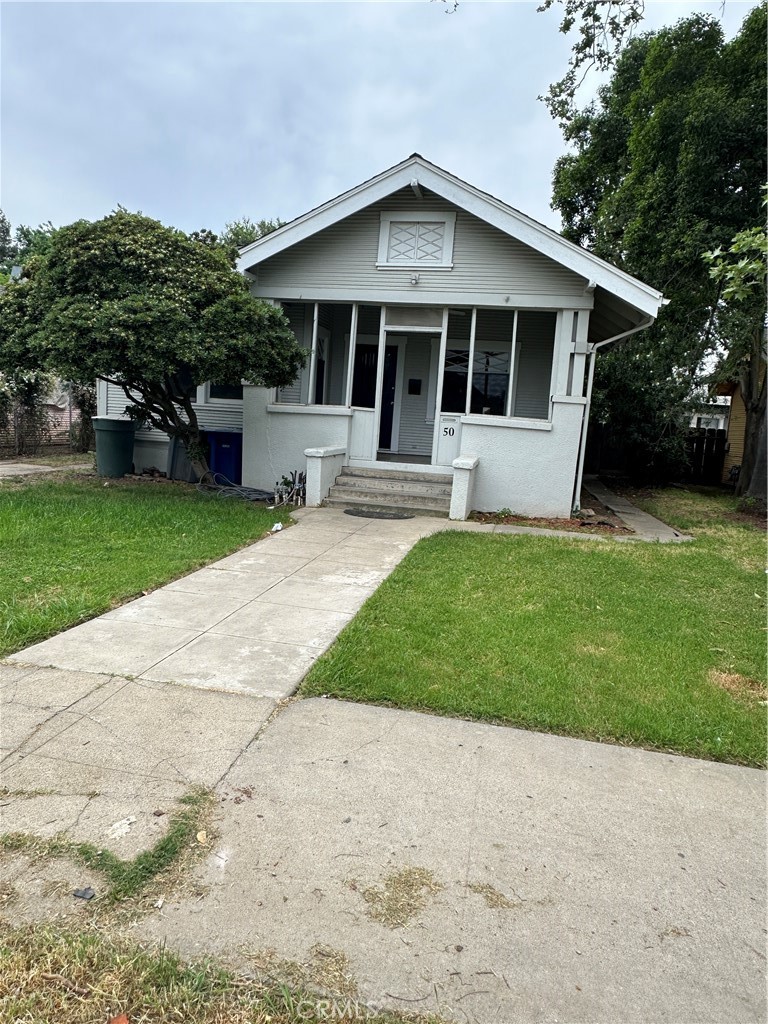 50 West 20th Street Merced, CA 95340 - Photo 4 of 20 a front view of a house with a yard