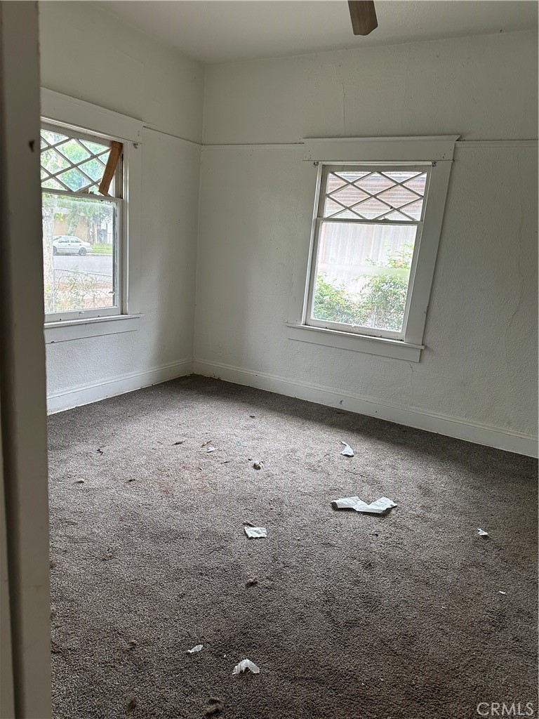 50 West 20th Street Merced, CA 95340 - Photo 6 of 20 an empty room with windows