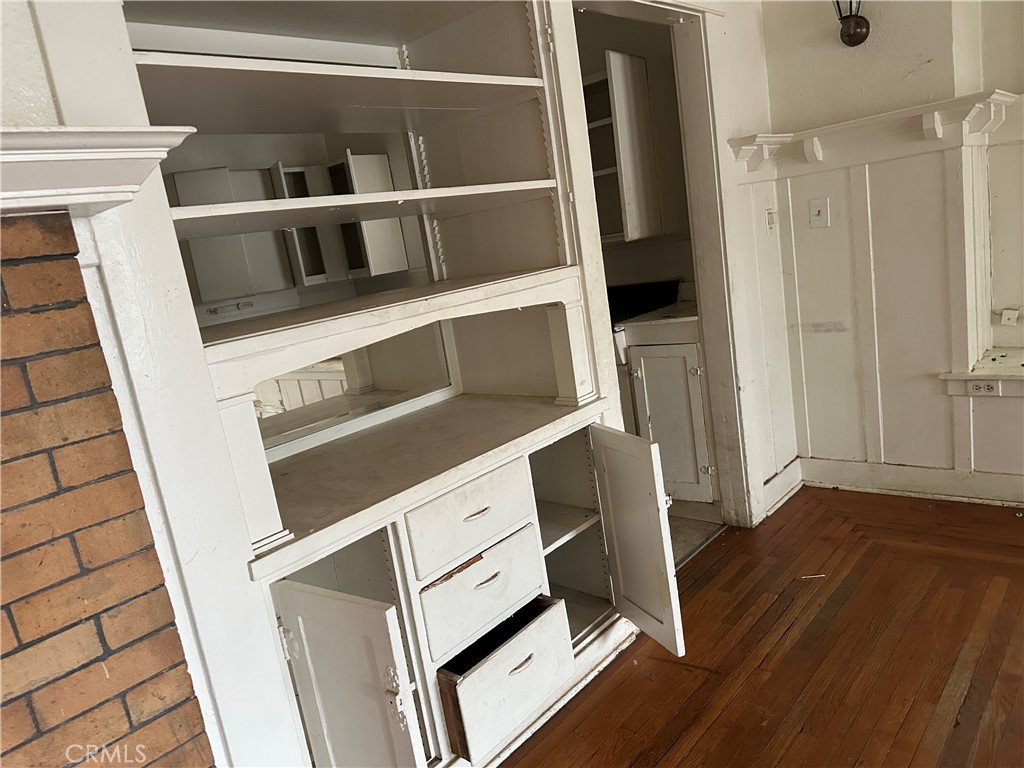 50 West 20th Street Merced, CA 95340 - Photo 10 of 20 a view of an empty room with wooden floor and a cabinet