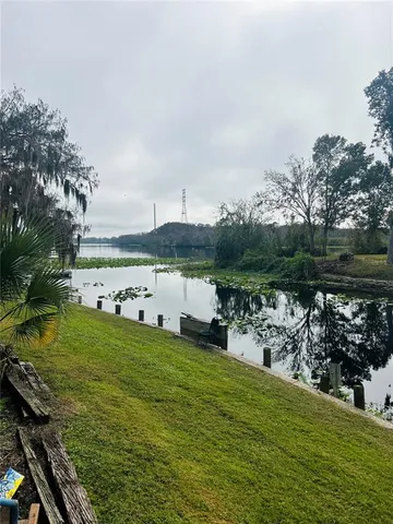 a view of a lake with a big yard