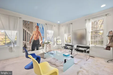 a spacious bedroom with a bed and a couch