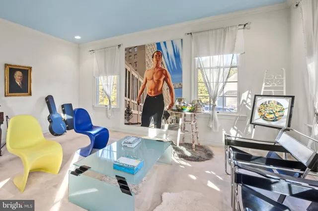 a bedroom with a rug and a walk in closet