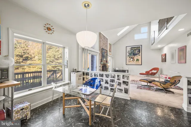 a bathroom with a sink a mirror and a shower