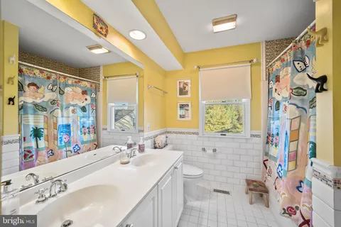 a view of a hallway with paintings on the wall