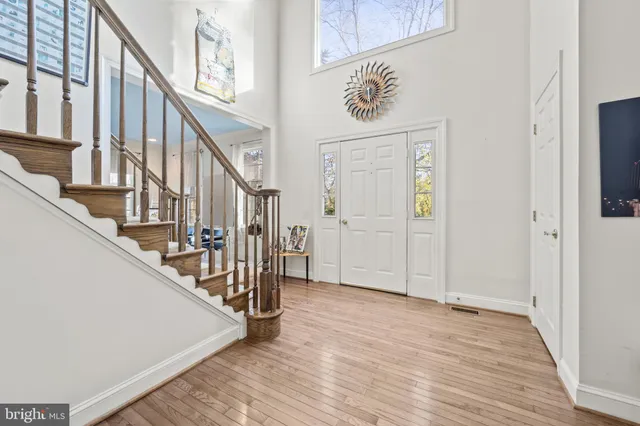 a view of an entryway with wooden floor