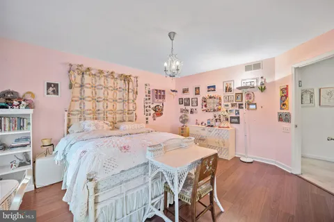 a bathroom with a sink a toilet a mirror and shower