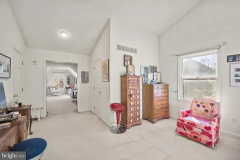 a view of a balcony with wooden floor and fence
