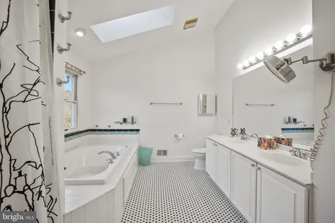 a view of a brick house with large windows