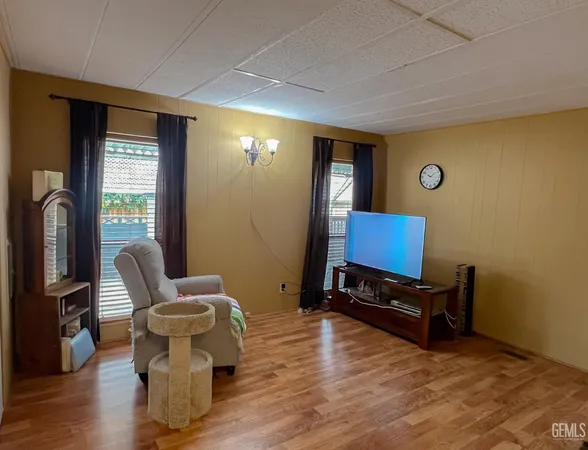 a view of workspace with wooden floor windows
