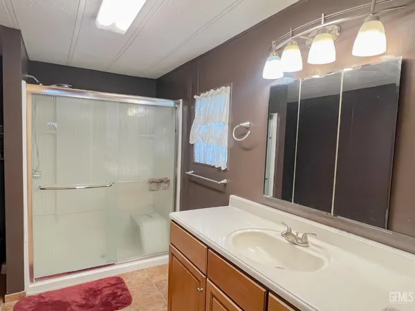 a bathroom with a sink and mirror
