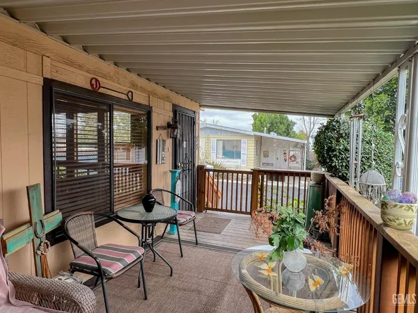 a view of a porch with furniture