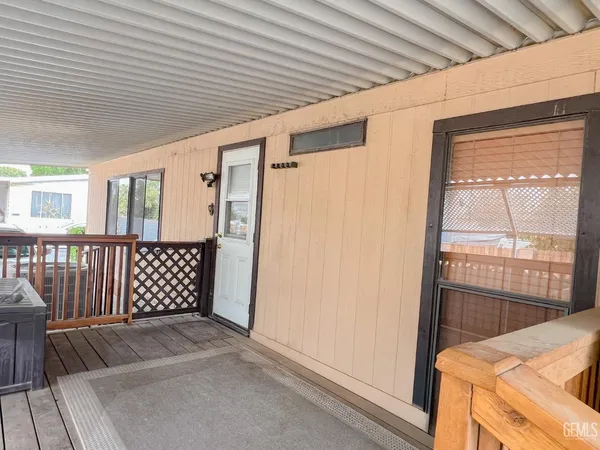 a view of a porch with wooden floor